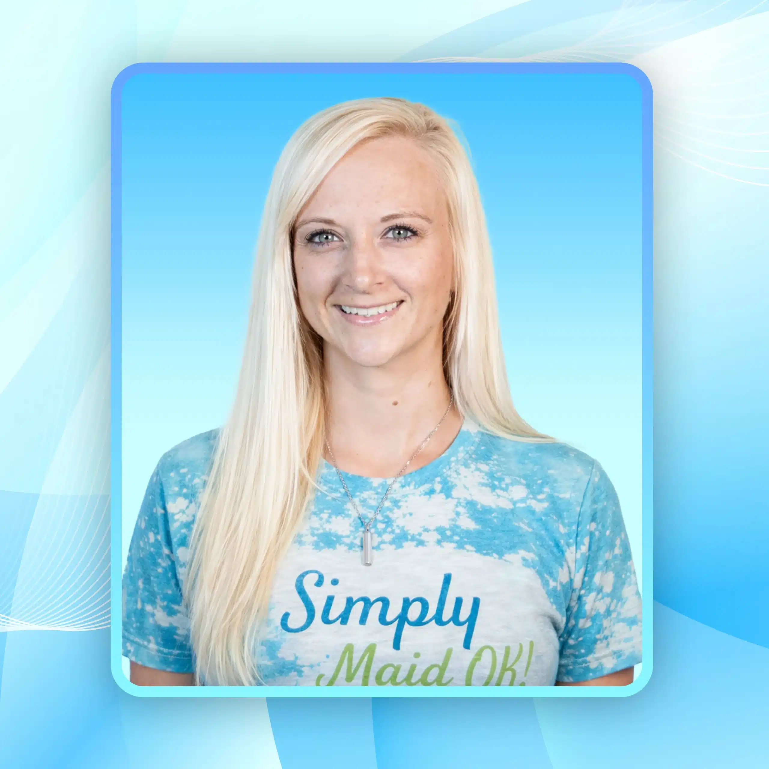 Stephanie Ramsey, owner of Simply Maid, smiling in a blue tie-dye shirt with "Simply Maid OK!" text, against a light blue background, representing the cleaning service team.