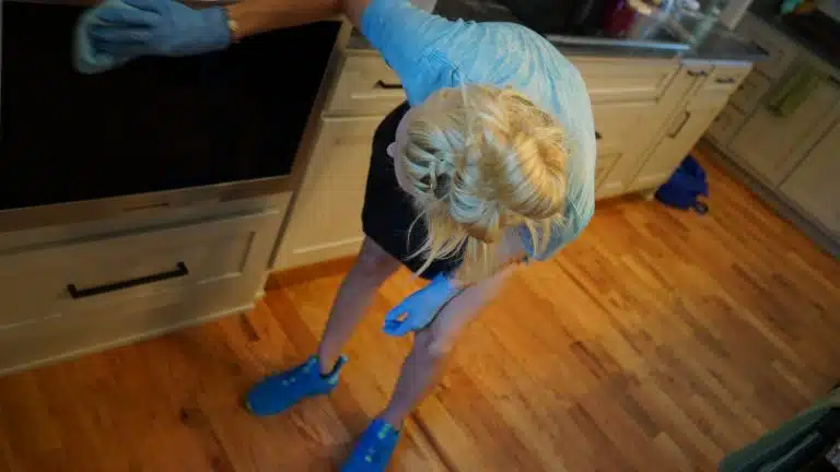 Simply Maid Sparkle Technician cleaning an oven during a move-out clean