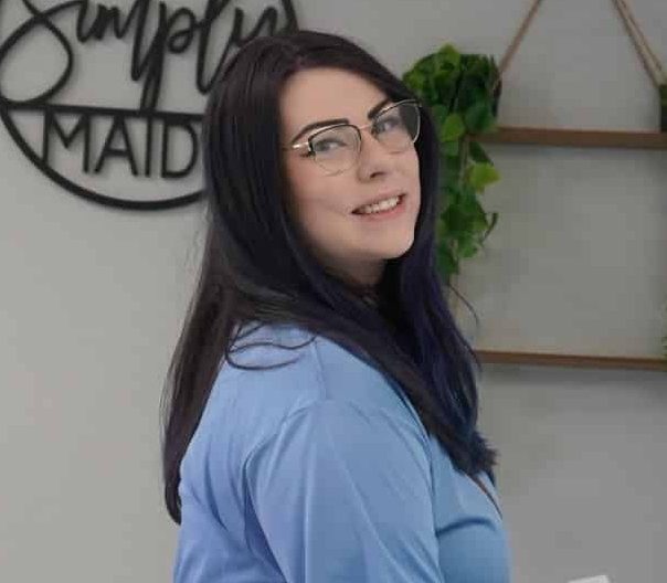 Stephanie, Simply Maid Chief Shine Coordinator, smiling and wearing glasses.